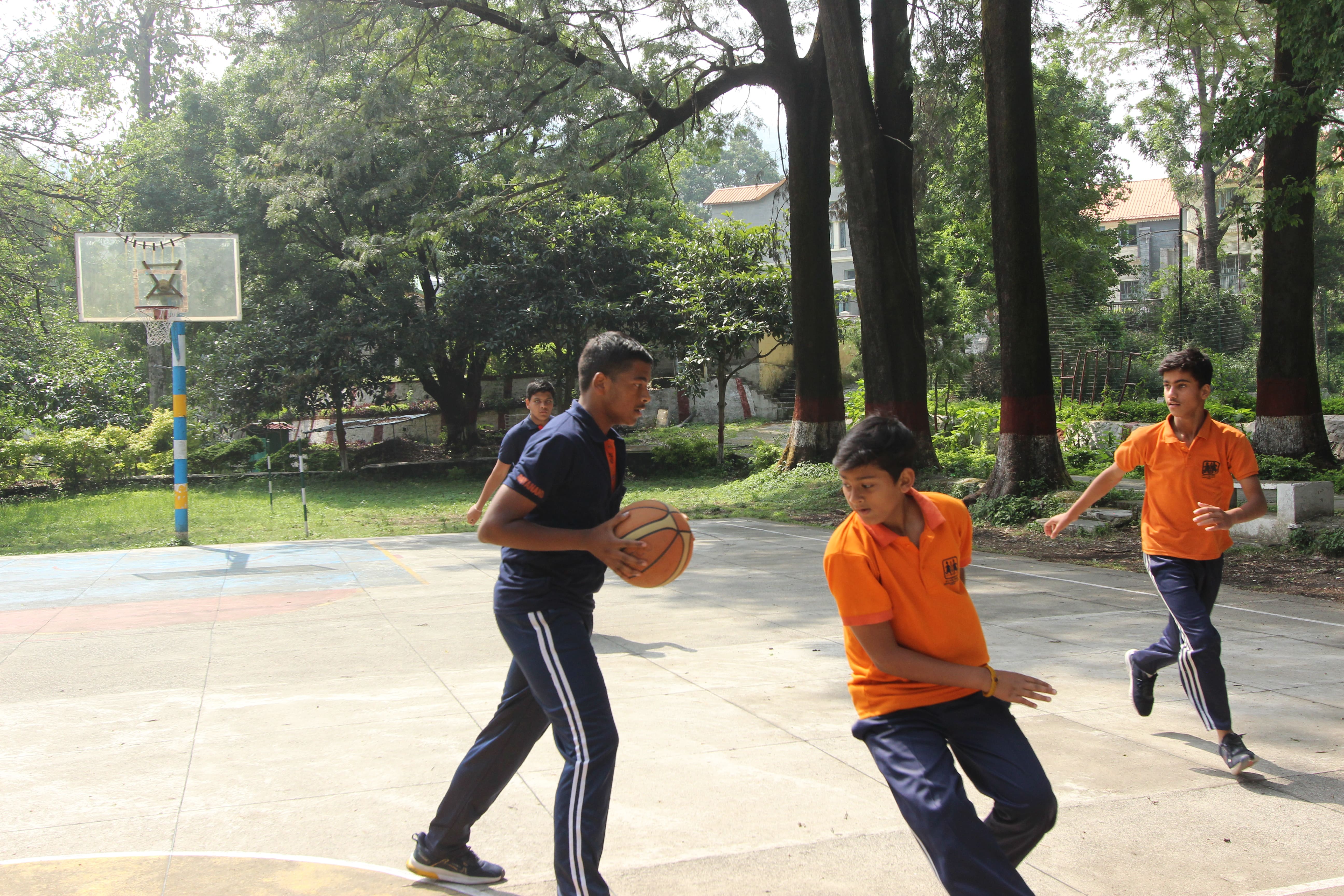 Students playing basketball on the HGS Bhimtal campus